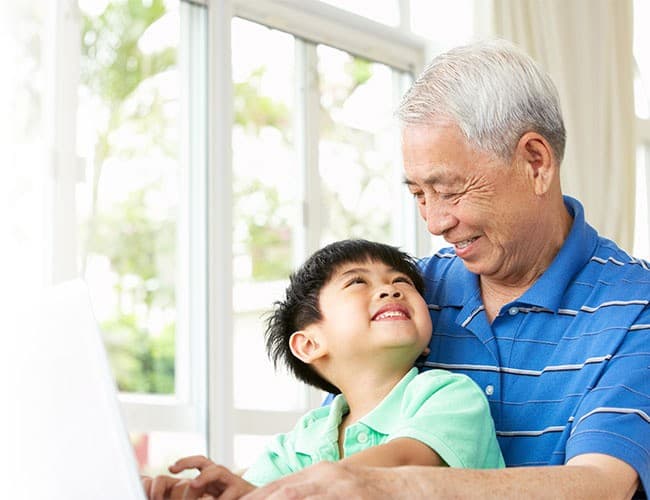 Family sharing photos together in a cozy home setting.